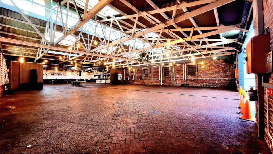 conference tables in the warehouse at the old biscuitmill